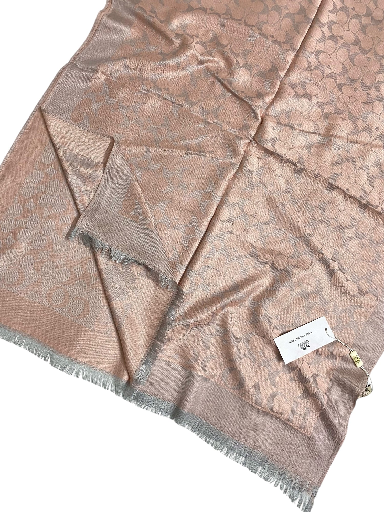 Branded Jacquard Hijab in teapink, showcasing intricate woven pattern.