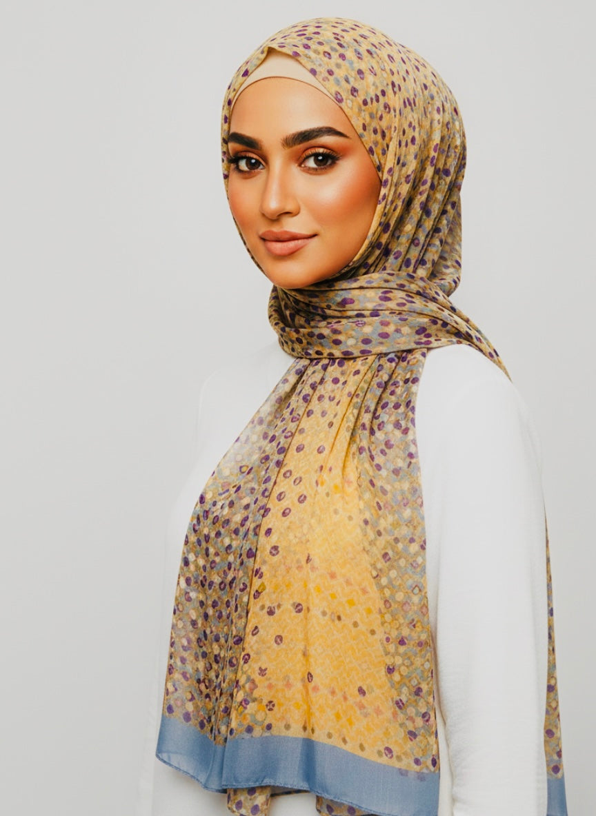 Elegant Premium Printed Hijab featuring a subtle floral pattern in muted tones, draped gracefully.