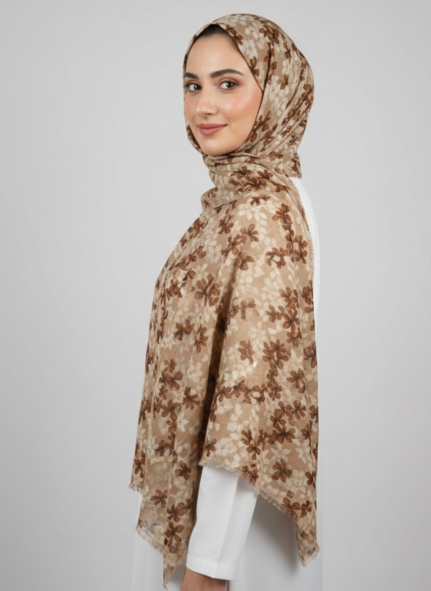 Elsa Printed Hijabs - Beige, a soft beige hijab with a subtle, elegant print, draped for display.